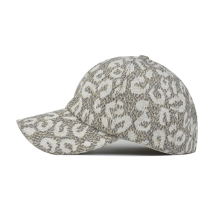 Detailed close-up of thick leopard pattern knit fabric on a stylish ponytail baseball cap