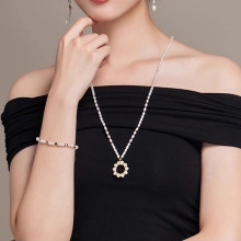 Close-up of elegant freshwater pearl jewelry set featuring necklace, bracelet and earrings