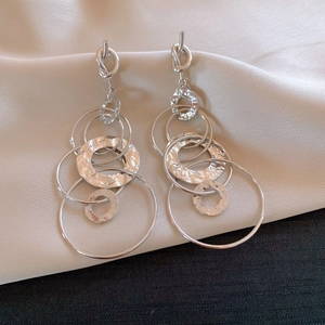 Polished silver geometric hoop earrings with twisted studs and hammered texture discs