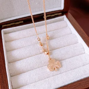 Vintage gold clover pendant necklace with 520 engraving and faceted metal beads