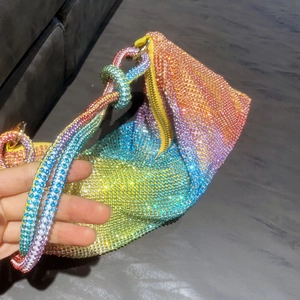 Detailed macro view of rainbow rhinestone handbag with colorful gradient crystals