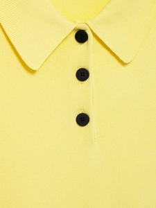 Detailed view of the yellow knit polo collar and buttons with high-quality texture