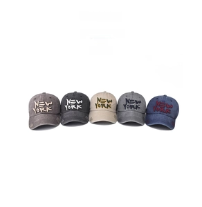 Row of washed cotton baseball caps in five colors with New York 3D embroidery detail