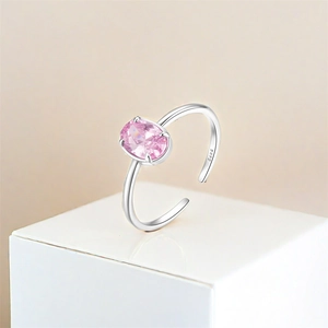 Detailed view of S925 silver adjustable ring with pink oval zircon on white stand