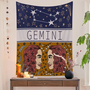 Detail of Gemini zodiac tapestry with artistic illustrations and star patterns