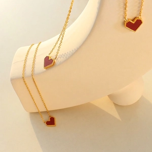 French style 18k gold plated titanium necklace with red heart pendant on display
