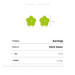Detail view of 7mm S925 sterling silver flower stud earrings with green enamel petals
