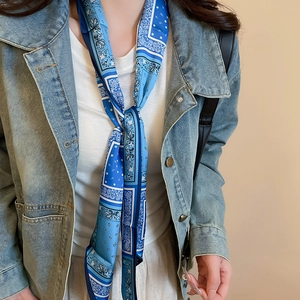 Detailed shot of blue paisley print silk scarf necklace with ethnic vintage design