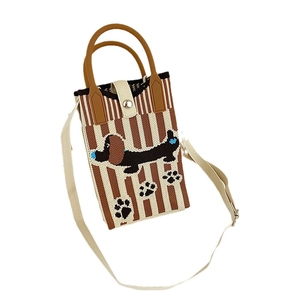 Knitted dachshund crossbody bag with brown stripes and adjustable strap on white background