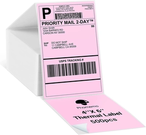 Detail of pink 4x6 thermal shipping label on white box with 500 sheets roll specs