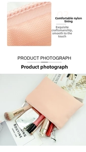 Detail of pink nylon makeup bag with honeycomb texture and secure metal zipper