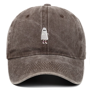 Detail shot of a small ghost embroidery on a brown washed cotton baseball cap texture