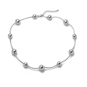 Polished silver bead necklace detail with fine rope chain and lobster clasp closure