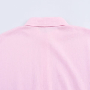 Detail of pink linen shirt back collar showing natural texture and stitching quality