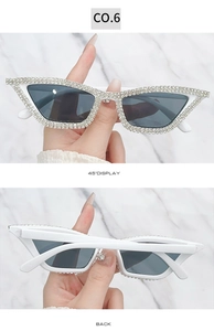 Detailed front and back view of cat eye sunglasses with rhinestones and grey lenses