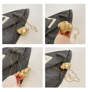 Detailed views of gold metallic cloud-shaped crossbody bag with slim chain strap