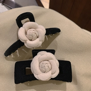 Elegant camellia hair claw clips in black velvet and cream fabric, French vintage style
