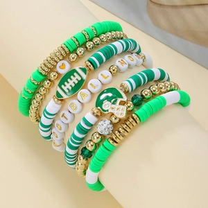 Detail of five-piece football mom bracelet set with green heishi beads and enamel charms