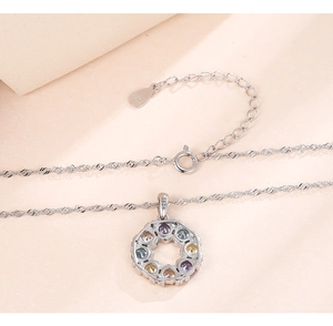 Detailed macro view of S925 silver necklace featuring a colorful gemstone pendant