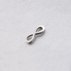 Macro detail of silver mirror polished stainless steel infinity connector for DIY jewelry