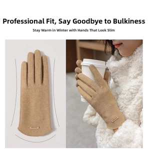 Detail of warm thermal gloves featuring a slim-fit design and branded leather patch