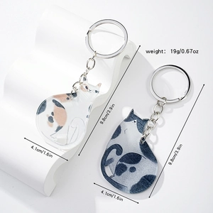 Detailed size view of two cute cartoon acrylic cat keychains with metal chains and rings