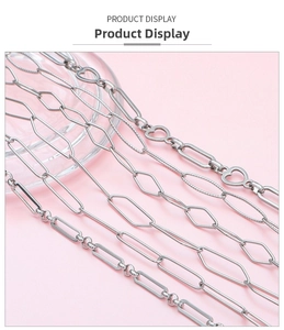 Detail view of five different stainless steel chain styles including heart and oval links