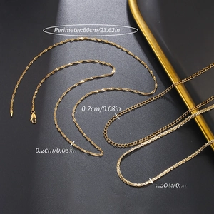 Detail of diverse golden stainless steel flat chains including snake and link styles