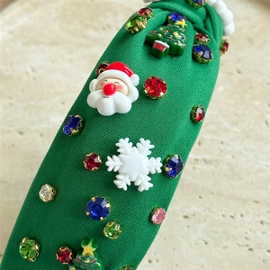 Detail of Christmas headband with Santa, tree icons, and colorful rhinestones