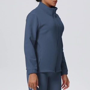 Detail of dark blue fleece jacket with high collar zipper and soft thermal fabric
