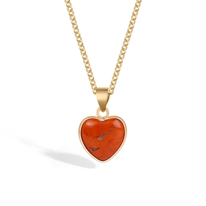 Minimalist gold chain necklace featuring a heart-shaped red jasper stone pendant with gold trim