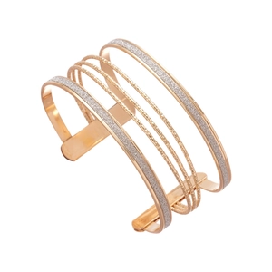 Modern layered geometric open cuff bracelet in rose gold finish with textured metal details