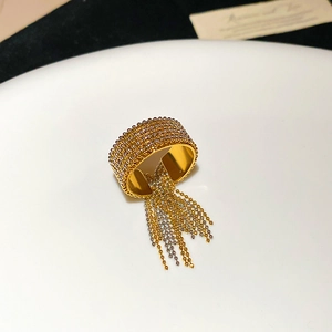 Detailed view of bicolor beaded stainless steel ring with elegant hanging chain tassels