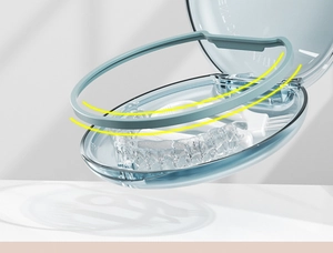 Detail view of the 3-layer denture storage box showing sealing ring and cleaning brush