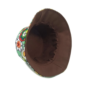 Close-up of reversible bucket hat with colorful floral print and solid brown interior