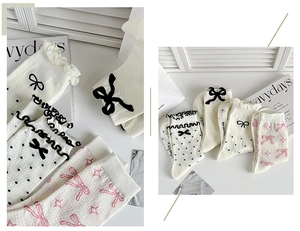 Detail of white cotton socks with cute bows, polka dots and lettuce trim edges
