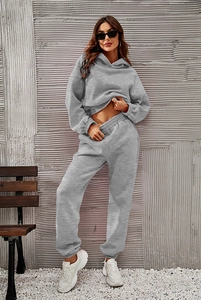 Detail of grey hooded tracksuit featuring ribbed cuffs and soft fleece texture