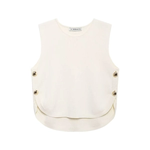 Close-up of cream knit vest featuring decorative gold side buttons and curved hem detail