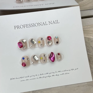 Handmade press-on nails with sparkling gemstones on nude pink base 10-piece set