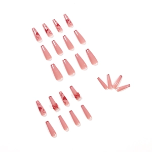 Pink ballet style press-on nails with red bow accents and heart pattern set