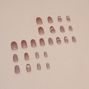Daisy cat-eye nail set with pink gradient glitter and rhinestone flower design