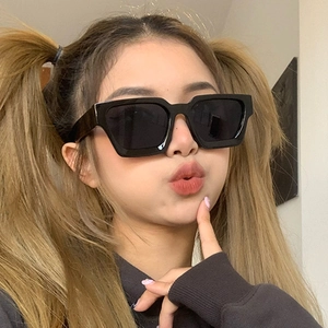 Modern thick frame rectangular sunglasses with glossy black finish for women