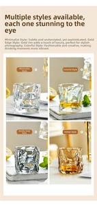 Detail of four colorful origami style whiskey glasses in clear, iridescent, gray, and amber