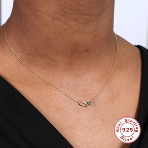 S925 Sterling silver gold oval and green gemstone pendant necklace on female model