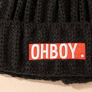Black knit beanie with red OHBOY embroidery patch in a classic ribbed winter style