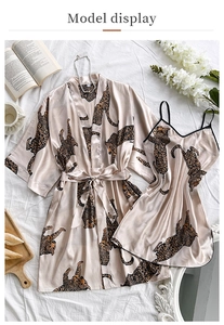 Detailed flat lay of champagne leopard print silk satin robe and V-neck slip dress set