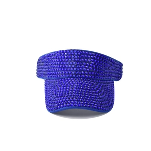 Detail of royal blue sun visor hat featuring intricate rhinestone embellishments