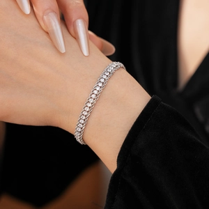 Close-up of sparkling adjustable chain bracelet with rows of round cubic zirconia