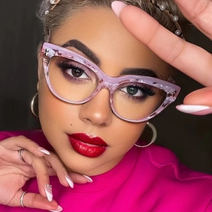 Detailed close-up of pink marble texture cat eye glasses frame on model face