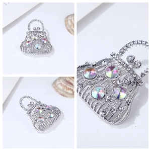 Macro detail of silver handbag brooch with sparkling crystals and colorful rhinestones
